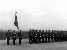 a black and white photo of a group of soldiers