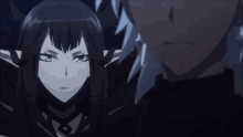 a man and a woman are looking at each other in a dark room