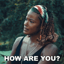 a woman with braids and a headband is asking how are you
