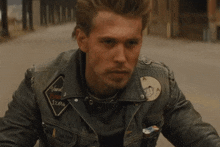 Benny Looking Intense While On His Motorbike The Bikeriders Film GIF - Benny Looking Intense While On His Motorbike The Bikeriders Film The Bikeriders GIFs