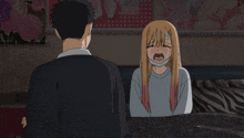 a man stands next to a girl who is crying with a bandage on her head