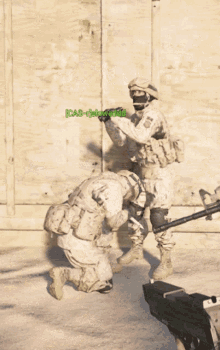 two soldiers are kneeling down and one is holding a gun and the other is kneeling down and holding a knife