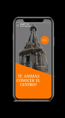 a phone with a picture of a building and the words te animas conocer el centro on the screen