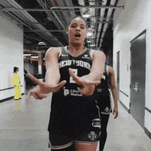 a woman in a new york jersey is dancing