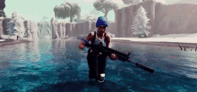 a man in a blue hat is holding a rifle in the water