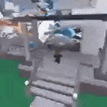 a blurry picture of a person walking down stairs in a building .