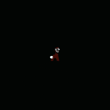 a cartoon character with a skull on his arm is standing in the dark .