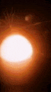 a close up of a glowing object with a black background