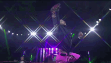 a wrestler in a ring with a sign that says ' sd ' on it