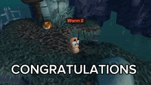 a video game screen says congratulations and shows worm 2