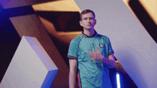 a man is wearing a shirt that says riot league season on it
