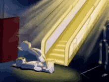a cartoon character is sitting on the floor in front of a slide .