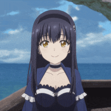 a girl with long black hair is smiling in front of a body of water