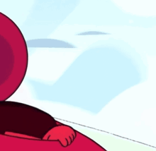 a cartoon character with a very angry face is peeking out from behind a red object .