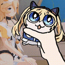 a hand is holding a cartoon cat with blue eyes in front of a doll .