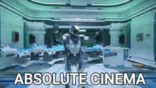 a robot is standing in a hospital room with the words absolute cinema below it