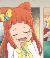 a girl with red hair and a yellow bow on her head is making a sad face