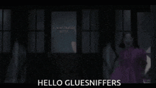 a woman in a purple dress is standing in front of a sign that says hello gluesniffers