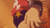 a person holding another person 's hand with a yellow star on the back