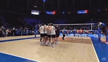 a group of volleyball players huddle together with the number 4 on their jersey