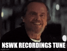 a man with a beard is smiling with the words `` nswk recordings tune '' below him .