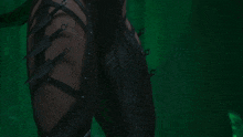 a close up of a person 's arm with a few knives on it