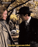 a man and a woman are standing next to each other and the man is saying they do n't have men killed .