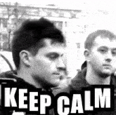 a black and white photo of two men with the words keep calm on the bottom