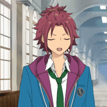 a boy with red hair is wearing a purple jacket and a green tie