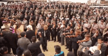 a large group of men are playing instruments in a band