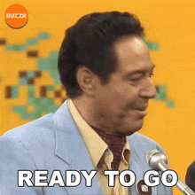 a man in a blue suit says ready to go