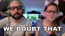a man and a woman wearing headphones are sitting next to each other with the words we doubt that written on the bottom