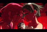 a couple of anime characters are kissing each other in a red background .