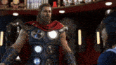 a man in a thor costume is standing in front of a woman