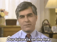 a man sitting on a couch with the words our future is on the line above him