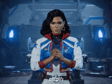 a woman in a red white and blue jacket with the word mtrgifs on the bottom right