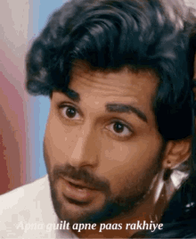 a close up of a man 's face with the caption apna guilt apne paas rakhiye