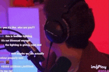 a man wearing headphones is talking into a microphone on a purple background .