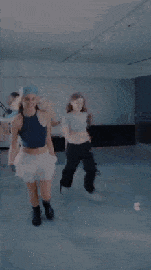 a group of young women are dancing together in a dance studio