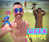 a man taking a selfie on the beach with geek pride written in the corner
