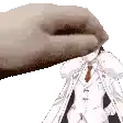 a hand is holding a piece of paper with a person in a suit and tie .