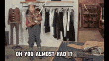 a man holding a sword in a store with the words oh you almost had it written below him