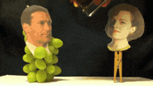 a painting of a man and a woman with grapes on them
