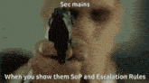 a man in a suit is pointing a gun at the camera with the caption sec mains