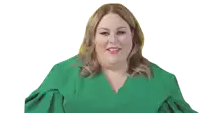 a woman in a green gown is smiling