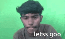 a man with a mustache is making a funny face with the words `` letss goo '' .