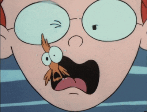 Pepper Ann has her head underwater and a goldfish points a sign at her that says Wacko