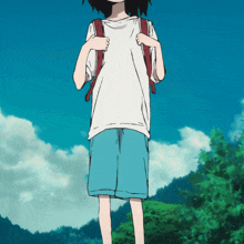 a boy with a backpack on his back stands in front of trees