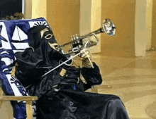 Chacal Sentando En Silla Tocando La Trompeta GIF - Chacal Fuera Trompeta GIFs