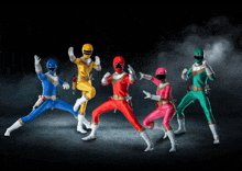 a group of power rangers are posing for a picture together